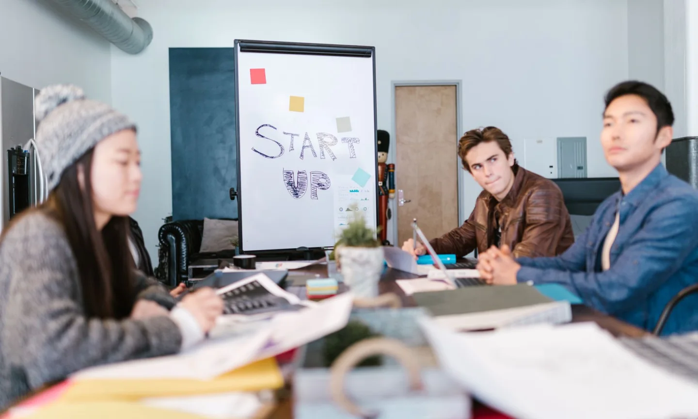 A team brainstorming around a desk