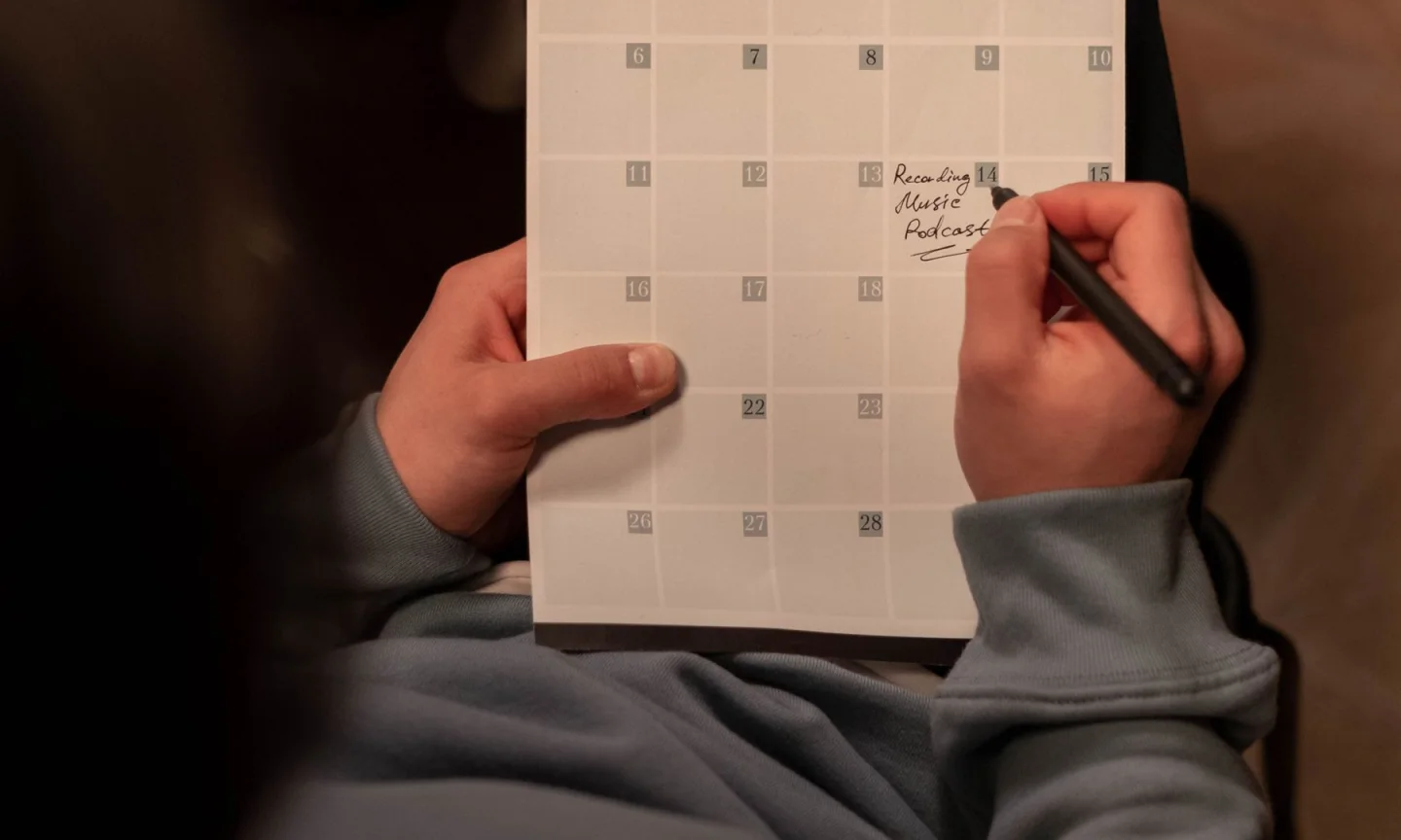 A person organizing work in a content planner