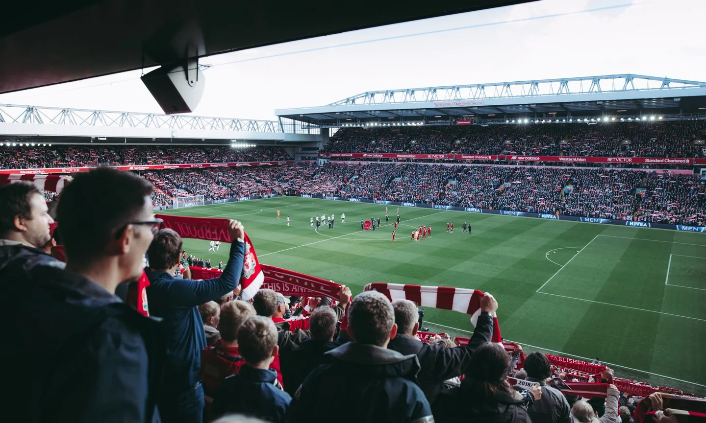 Spectators watching a football match from the stands