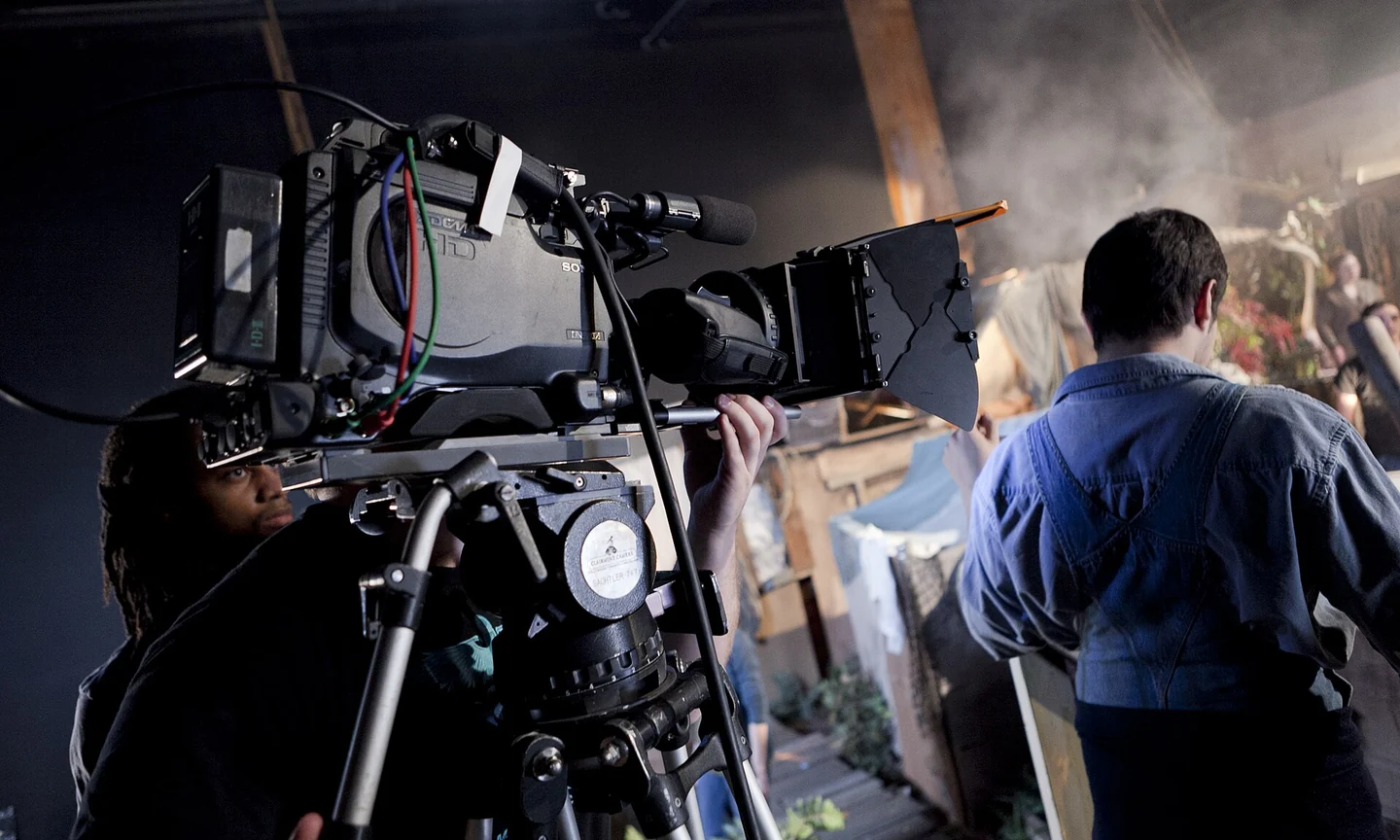 Camera crew working together on a film set